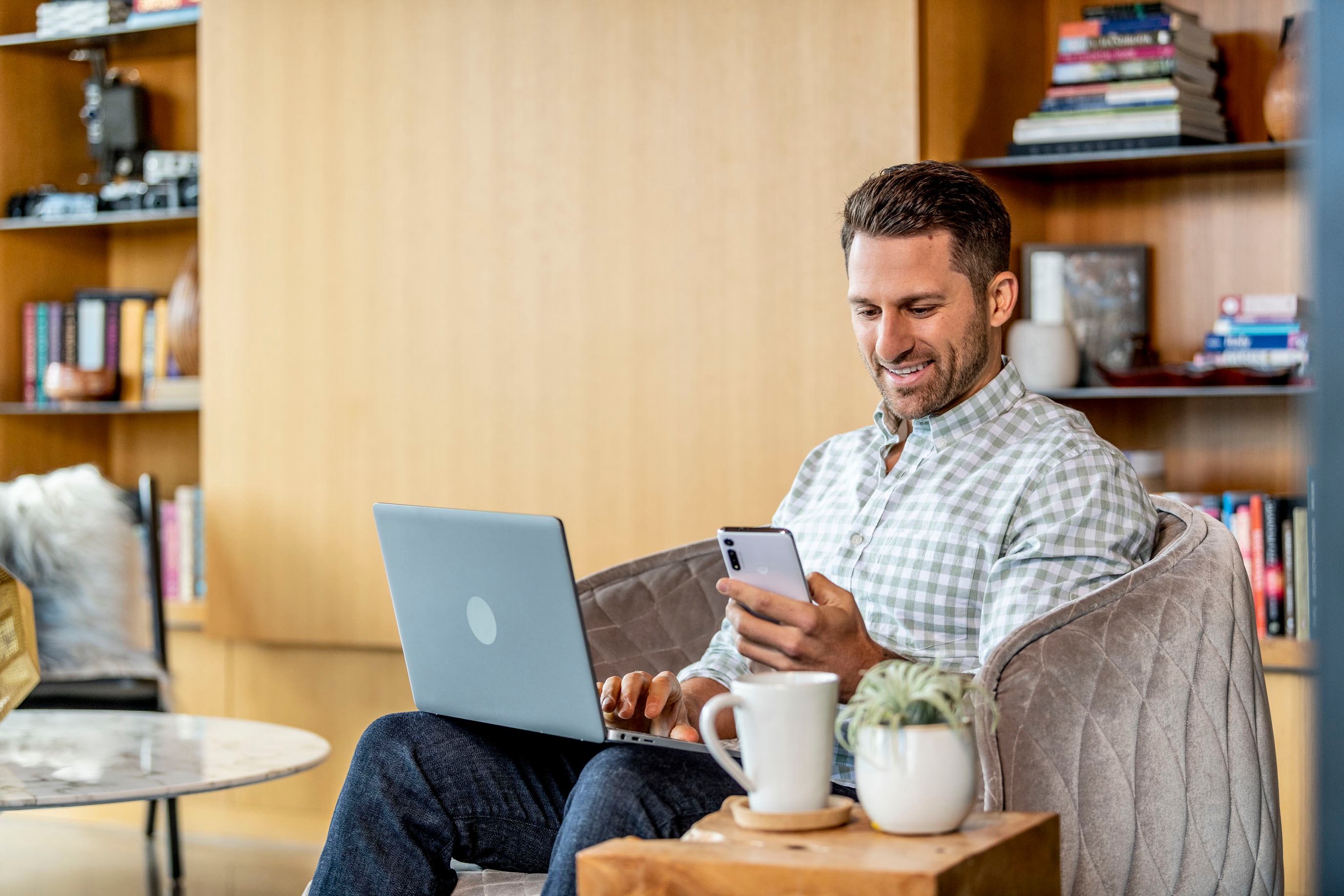 man smiling with phone